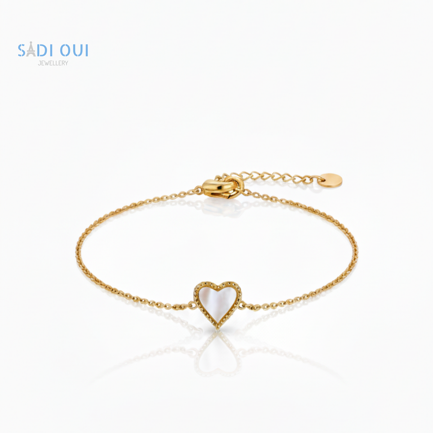 Pulseira Sentir SADI OUI em aço inoxidável dourado com coração branco em fundo claro