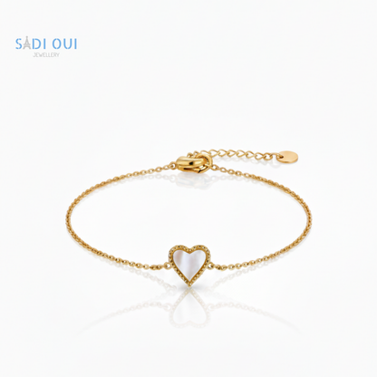 Pulseira Sentir SADI OUI em aço inoxidável dourado com coração branco em fundo claro